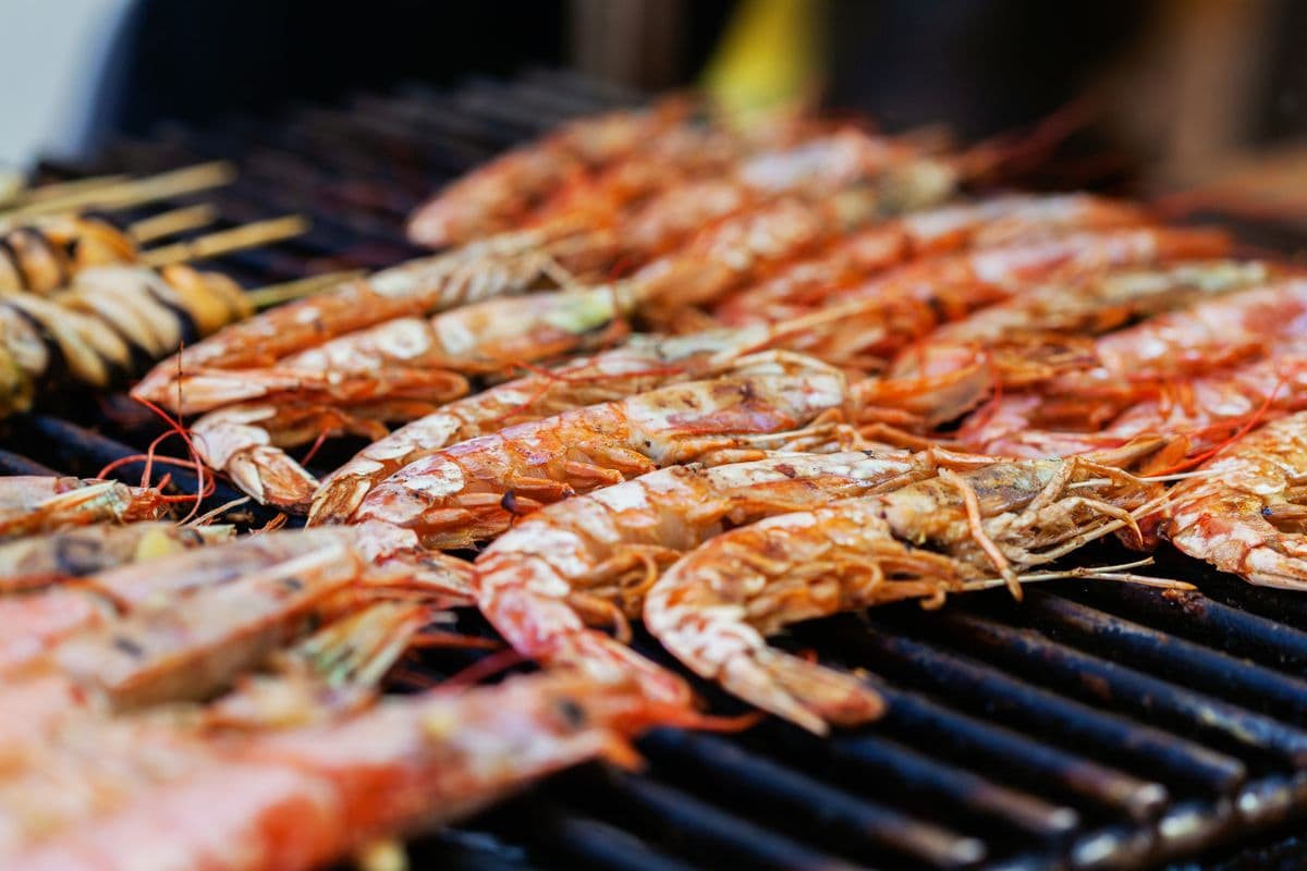 Grilled prawns and seafood over a hot charcoal grill