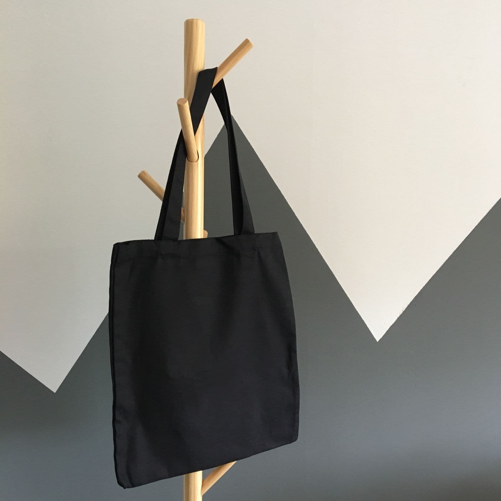 18 oz canvas with seams you could tow with. Carries the market and the studio.