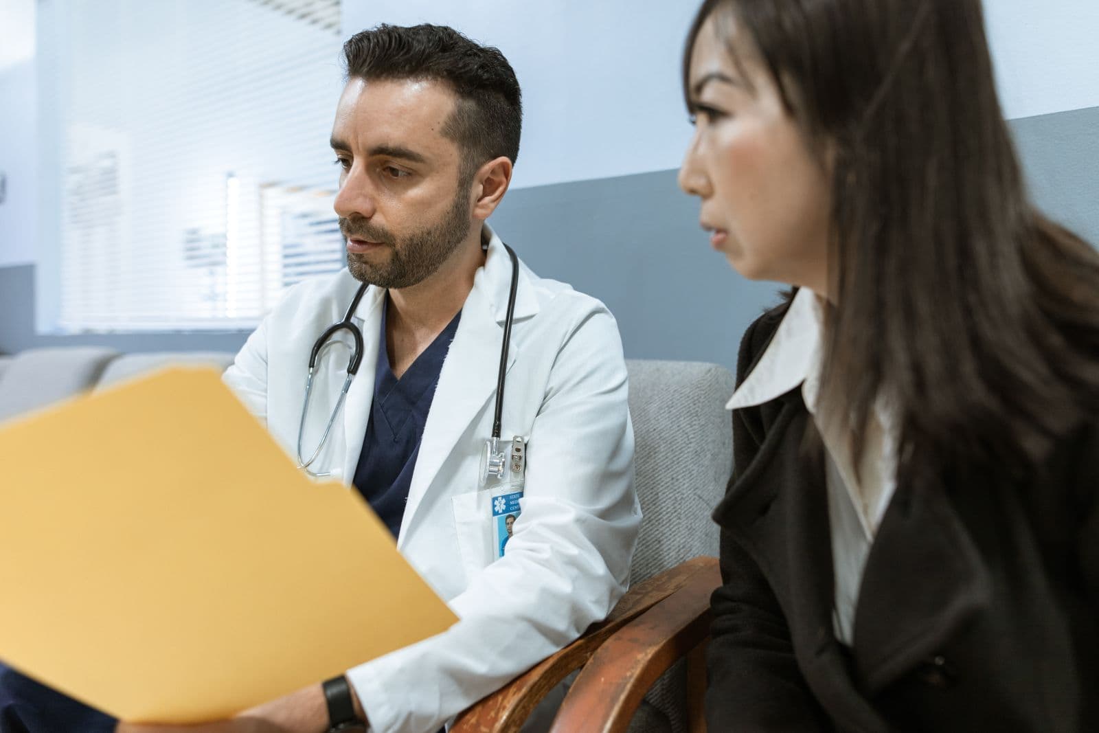 Doctor discussing health records with a patient