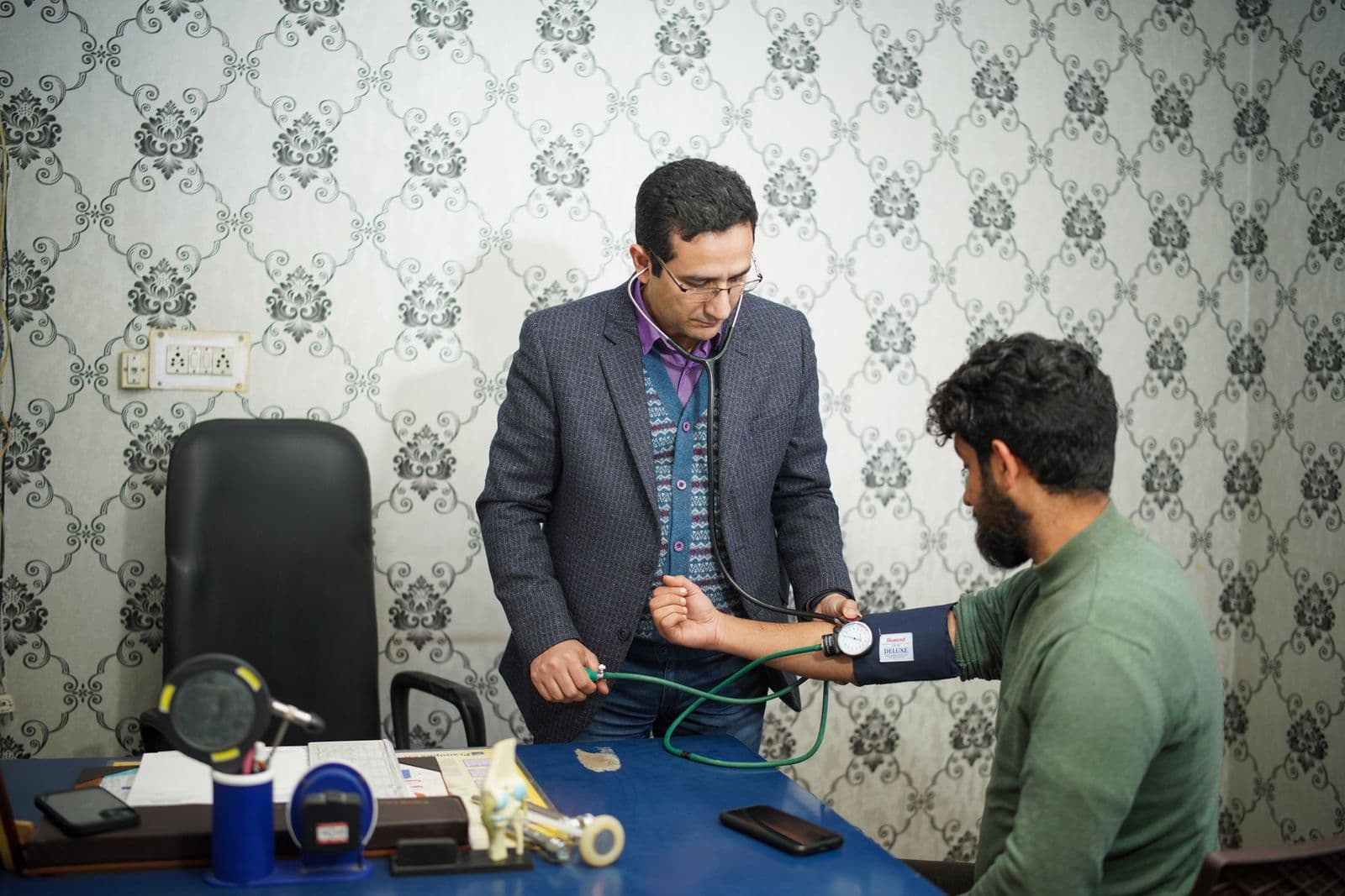 Doctor taking a patient's blood pressure